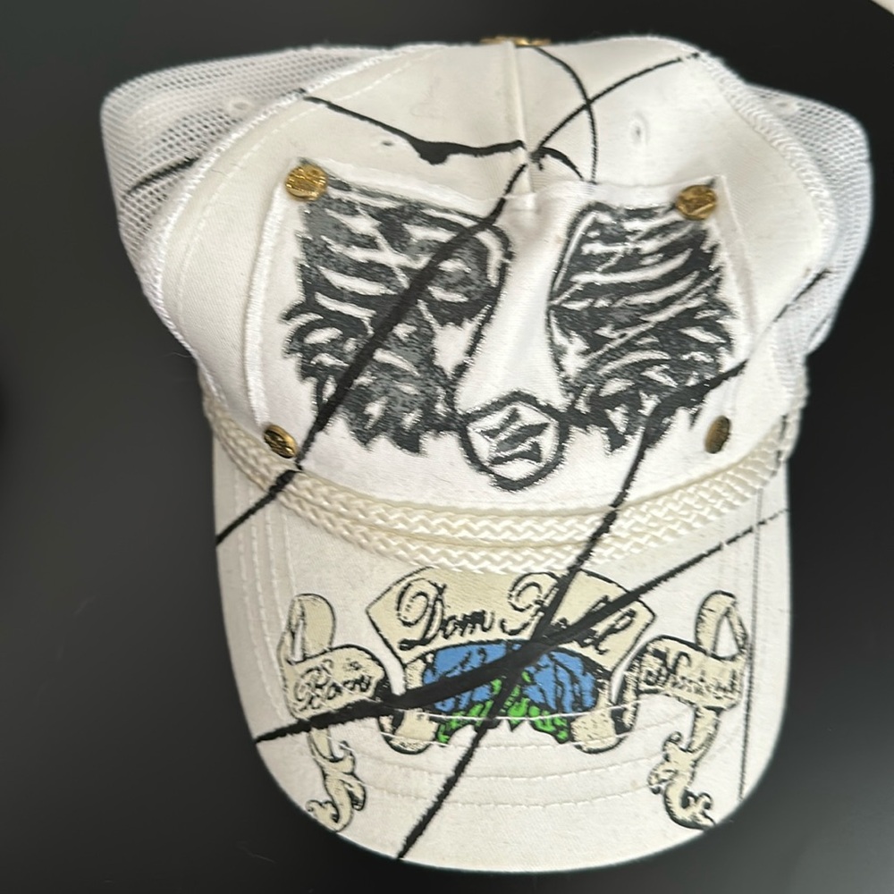 Dom Rebel snap back hat. Angel wing details on back.